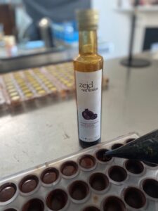 a photo of a bottle of pomegranate molasses used in the chocolate ganache