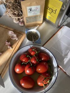 bowl of tomatoes, with some garlic and oregano and EVOO to make a tomato sauce