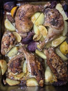 chicken pieces rubbed with za'atar mix and roasted with potatoes and lemon and extra virgin olive oil