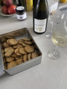 za'atar and parmesan biscuits with a glass of white Lebanese wine