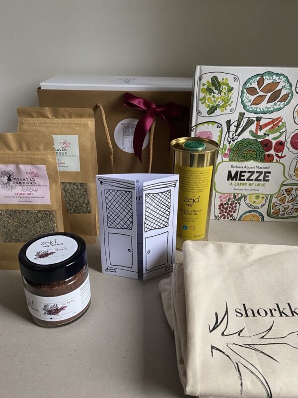 shorkk xmas gift box with the contents displayed, a recipe book, extra virgin olive oil. sumac, za'atar, oregano and a free tote bag with a gift card.