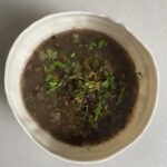 a bowl of sumac and herb soup