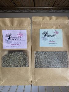 a packet of Bassatin Baanoub's za'atar mix on the left and a packet of oregano on the right for a special offer in May